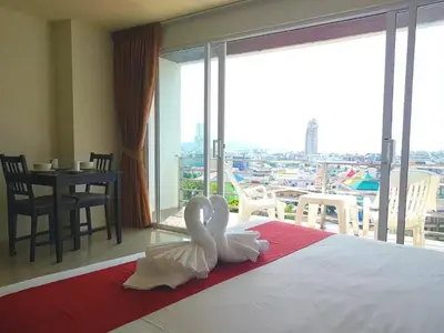 a hotel room with two swans on a bed at C257 Studio Seaview Near Beach Pool & Gym View in Patong Beach
