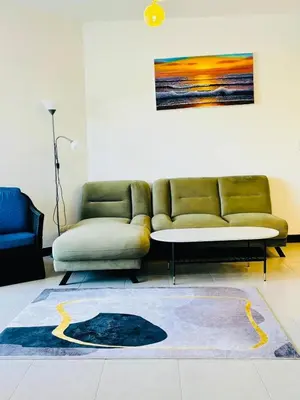 a living room with a couch and a table at Allamanda 2 lake side pad in the heart of Laguna in Laguna Phuket