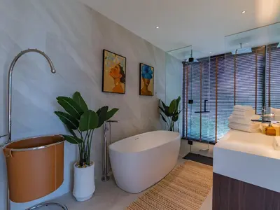 a bathroom with a bath tub and a sink at NEW Luxury Seaview 3BR Villa in Layan - Villa Luma in Layan Beach