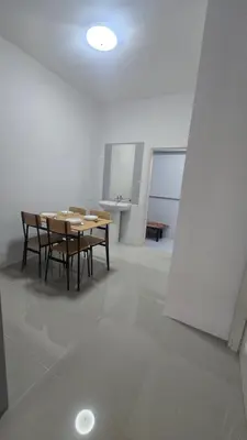 a dining room with a table and chairs in a room at Phuket villa airport in Nai Yang Beach