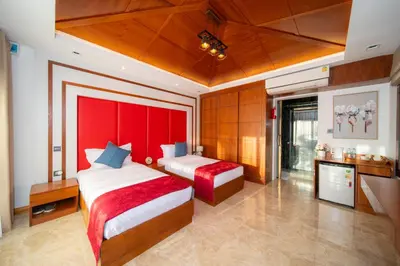a bedroom with two beds and a red headboard at D Villa Phuket-Luxury 6-Bedroom Private Villa in Panwa Entire Place in Phuket Town