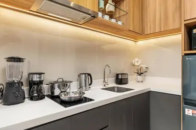 a kitchen with a sink and a counter top at Laguna LakeSide Residences by My Home Phuket in Bang Tao Beach