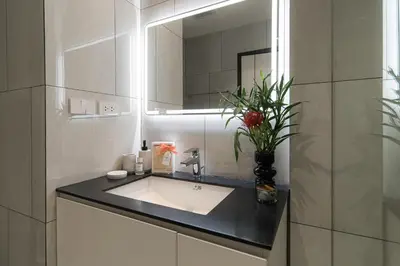a bathroom with a sink and a mirror at Title Legendary Apartment 800m to Bang Tao Beach in Bang Tao Beach