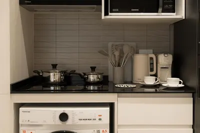 a kitchen counter with pots and pans on a stove at Title Legendary Apartment 800m to Bang Tao Beach in Bang Tao Beach