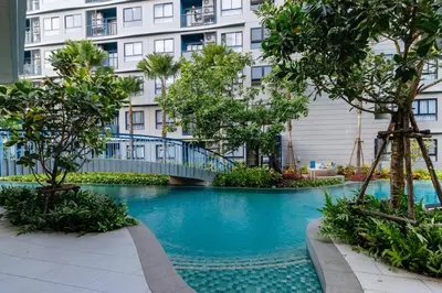 a swimming pool in front of a building at C262 Relax 2BR Condo with Pool and Full Gym in Kathu