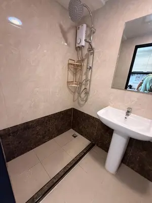 a bathroom with a sink and a mirror at The Signature Studio at Mai Khao by FAMILY HOMES CB-846 in Ban Mai Salae