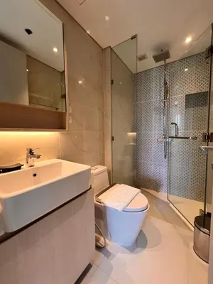 a bathroom with a sink and a toilet and a shower at Cassia Residences Condo in Laguna Phuket in Laguna Phuket