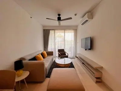a living room with a couch and a table at Cassia Residences Condo in Laguna Phuket in Laguna Phuket