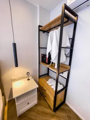 a room with a bunk bed with white towels at Rawai Lalaland Studio Apartments in Ban Saiyuan (1)