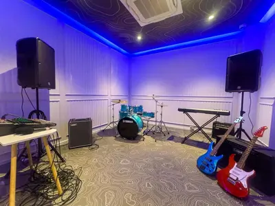 a room with three guitars in a room with purple walls at Luxury 2 bdr Title Legendary Bang Tao Pool View in Bang Tao Beach