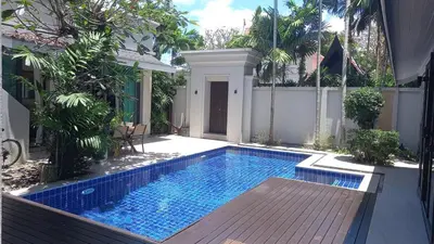 a swimming pool in the backyard of a house at 4-Bedroom cozy pool villa in the heart of Bang Tao in Laguna Phuket