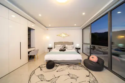 a bedroom with a bed and a large window at BangTao 5 Bedrooms 2026 New Modern Private Pool Villa Great Location Close to Bangtao Beach in Ban Thalat Choeng Thale