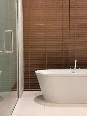a white bath tub in a bathroom with a shower at Botanica Four Season Luxury Pool Villa in Phuket