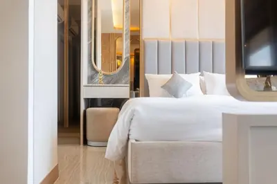 a hotel room with a bed and a television at Apartment in Laguna perfect location in Laguna Phuket