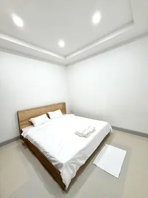 a white bedroom with a bed in a room at Home in Chalong 3 Bedrooms Fully Furnished in Ban Suan