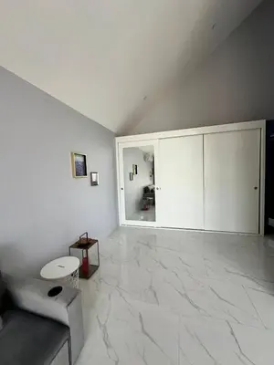 a living room with a large marble floor at Bangtao Family Villa with Pool in Ban Pak Lak
