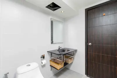 a bathroom with a sink and a toilet at C265 Great Ocean View 2BR Pool & Gym Near Beach in Patong Beach
