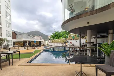 a pool in the middle of a building at C265 Great Ocean View 2BR Pool & Gym Near Beach in Patong Beach