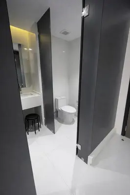 a bathroom with a toilet and a sink at Новые апартаменты в Utopia Naiharn in Rawai Beach