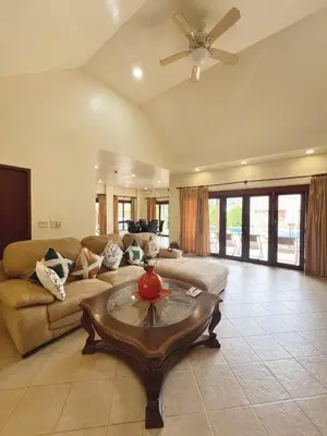a living room with a couch and a table at Luxury 3-bedroom villa with pool in Rawai in Rawai Beach