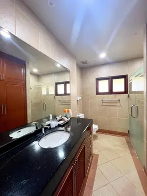 a bathroom with a black counter and a sink at Luxury 3-bedroom villa with pool in Rawai in Rawai Beach