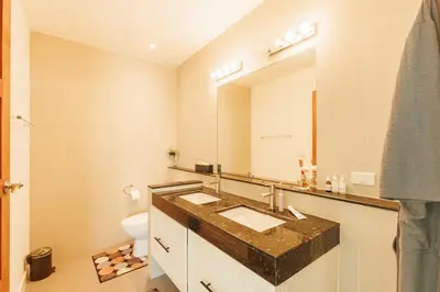 a bathroom with a sink and a mirror at Peaceful Villa 12 mins to Bangtao & Layan Beach in Ban Pak Lak