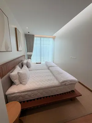 a large bed in a room with a window at New 3 Bed Villa Mono Oxygen Bangtao in Ban Thalat Choeng Thale