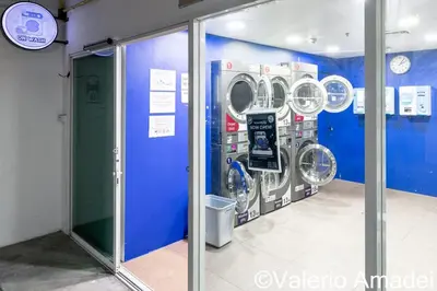 a washer and dryer in a room at Patong Center - Pool Gym Near Bangla Rd in Patong Beach
