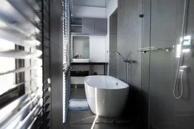 a bathroom with a bath tub and a shower at Villa Wallaya with pool in Bang Tao in Ban Pak Lak