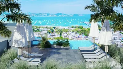a view of a pool with umbrellas and chairs at Woodbridge Property at Tower Chalong in Ban Klang
