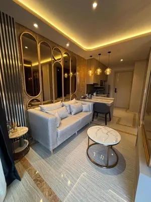 a living room with a couch and a table at Bellevue Lagoon Boutique - Bang Tao, Phuket Laguna in Laguna Phuket