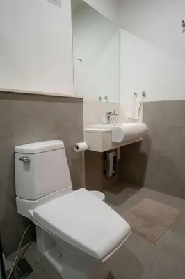 a bathroom with a white toilet and a sink at Beautiful Pool Villa in Pavilion and Tropical Oasis in Ban Pak Lak
