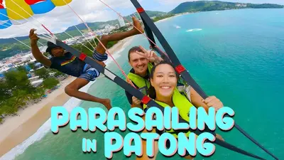 a poster for paragliding in paragalore at BAO Phuket Patong- ไสน้ำเย็น ซอย 1 in Patong Beach