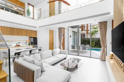 a living room with a couch and a table at V293 Be the First! Brand New Elite Pool Villa in Ban Thalat Choeng Thale