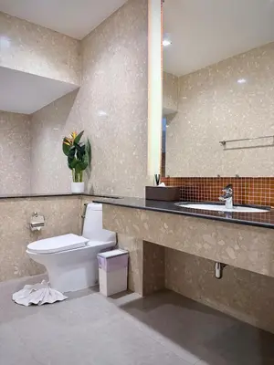 a bathroom with a toilet and a sink at ozone pool villa phuket in Ban Pa Khlok