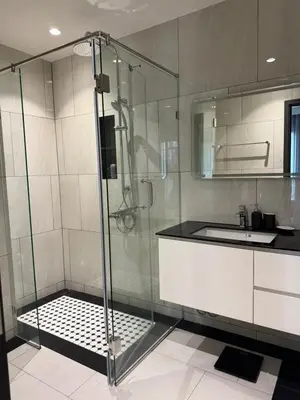 a bathroom with a glass shower and a sink at The Title Legendary swimming pool in Phuket
