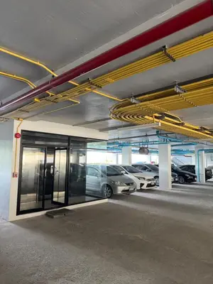 a parking garage with cars parked in it at VIP Great Hill Airport in Phuket