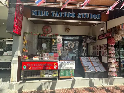 a guided tattoo shop with a sign on the front of it at MILD ISLAND STAY ROOm in Phi Phi Don