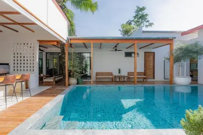 a swimming pool in the backyard of a house at Taraburi 6BR Pool Villa Phuket VVPHU91 in Thalang