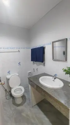 a bathroom with a toilet and a sink at Aonang room rent in Ban Khlong Haeng