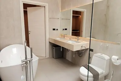 a white bathroom with a sink and a toilet at V-004 4 BR Unique Villa Baan Bua in Rawai Beach