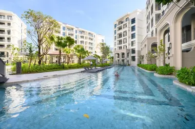 a swimming pool in the middle of a building at High-end 1BR at Title Bangtao by Sabay Rent E704 in Bang Tao Beach