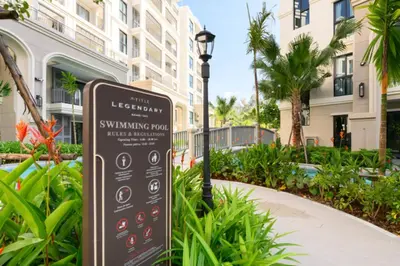 a sign in front of a building with a street light at Bangtao Premium 2BR Apartment, Title Legendary B201 in Bang Tao Beach