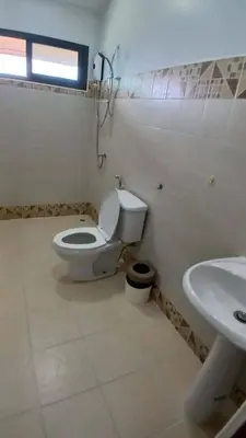 a bathroom with a toilet and a sink at Janjira sea view pool villa in Ban Ko Kwang