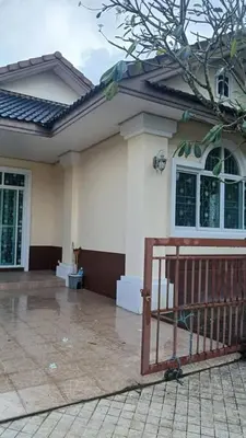 a house with a gate in front of it at Joyful House3 in Thalang