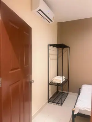a room with a door and a glass closet at Latte Home Krabi ลาเต้โฮมกระบี่ in Ao Nang Beach