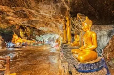 a painting of a cave with statues in it at Natureville cozy home near Samet Nangshe