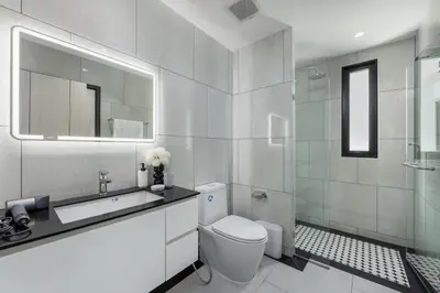 a bathroom with a toilet and a sink and a shower at Safi 1BR Suite — The Title Legendary BangTao in Bang Tao Beach