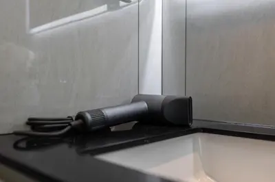 a black microphone sitting on top of a counter at Safi 1BR Suite — The Title Legendary BangTao in Bang Tao Beach