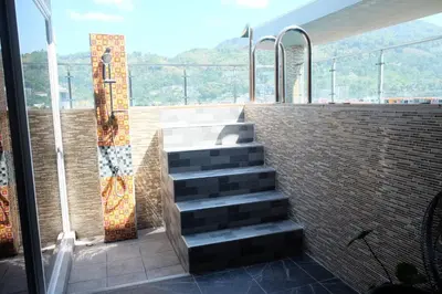 a set of stairs in front of a brick wall at Private Jacuzzi Pool Suite near walking street in Patong Beach